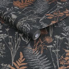 a black and orange wallpaper with various plants on it