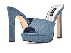 Nine West Wilia 7 - Women's Shoes : Blue Denim : Step out stylishly wearing the chic and classy Nine West Wilia 7 Heels. Textile upper. Man-made lining and insole. Slip-on style. Round peep-toe. High block heel. Brand logo on insole. Man-made outsole. Imported. Measurements: Heel height: 4.72 in, Platform height: 1.06 in. Weight of footwear is based on a single item, not a pair. Trendy Open Toe Mules With 4-inch Heel, Spring 4-inch Square Toe Heels, Trendy Formal Mules With High Heel, Modern Mules With 4-inch Heel, Chic Fitted High Heel Mules, Trendy Formal Mules With Deep Heel Cup, Modern 4-inch Heels For Spring, Trendy Fitted Sandals With Block Heel, Trendy Fitted Block Heel Sandals