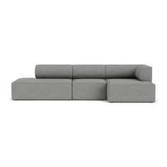 a large gray couch sitting on top of a white floor