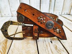 Welcome to our Etsy shop! This exquisite handmade light brown leather belt is a true testament to the craftsmanship of Ishaor. With its unique design, this belt captures the essence of the Western style, adding a touch of rugged charm to any outfit. Adorned with meticulously placed gold and silver rivets, this belt truly stands out from the rest. The combination of these elegant embellishments with the addition of silver coins creates a stunning visual appeal that sets this belt apart from tradi Handmade Belts, Light Brown Leather, Belt Design, Brown Leather Belt, Brown Belt, Belt Size, Leather Belts, Silver Coins, Nice Leather