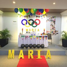 an olympic themed party with balloons and decorations