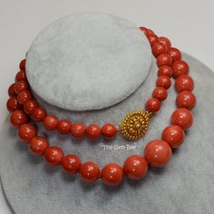 DESCRIPTION: Thank you for coming in! Spectacular 18K solid gold necklace with Mediterranean Sardinia Coral sphere beads, no dye, 100% natural tomato red color. 9.5mm-17.15mm large coral beads, 128 grams with a beautiful 18k solid gold clasp~Our favorite color for coral! The beads are premium quality, you do not find hairline cracks which are common with Mediterranean coral beads. Accompanied with GIA report number 2191866911 to assure your investment! You'll get the necklace you see! SIZE of co Luxury Necklace With Round Red Coral Beads, Elegant Orange Hand-strung Necklace, Elegant Red Coral Necklaces With Polished Beads, Elegant Coral Beaded Necklaces, Elegant Coral Round Bead Necklaces, Elegant Single Strand Red Coral Necklace, Elegant Single Strand Red Coral Necklaces, Luxury Necklace With Round Beads For Gift, Classic Coral Round Jewelry