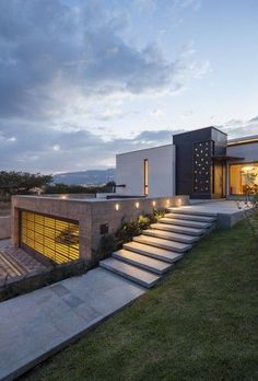 a modern house with stairs leading up to it