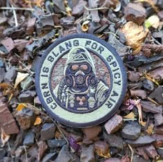 a patch on the ground that says braining for survival with an image of a man in a gas mask