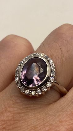 This is a vintage purple amethyst with amethyst sidestones set in 925 sterling We have in size 7 this can be sized to your specification, our jeweler charges $10-$20 please message us to discuss sizing your ring or engraving options. All of our jewelry is hand polished and shipped to you in a stylish gift box. We are happy to gift wrap for you. It is important to us that each customer be thrilled with their purchase. We are grateful for thousands of positive reviews. Purple Amethyst Ring, We Are Grateful, Amethyst Gem, Skull Bracelet, Purple Band, Gifts For My Wife, Silver Prices, Vintage Purple, Amethyst Ring