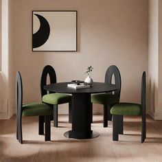 a black table with four green chairs around it