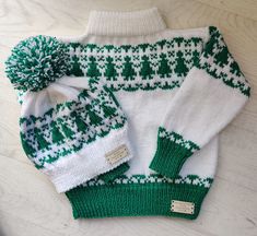 a green and white knitted sweater with matching hat