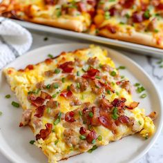 two slices of pizza on a white plate