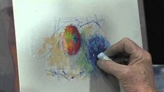 someone is drawing something with colored pencils on paper