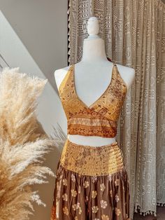 Choose bralette only, skirt only, or the two piece set~  BRALETTE DETAILS Gorgeous halter tie-back silk bralette in our stunning Desert Solstice© print! Perfect for a summer top, or fall layering.  S/M recommended for busts 30-34" L/XL recommended for busts 36-40" 2/3X recommended for busts 42-46"  SKIRT DETAILS Made from a beautiful lightweight silk blend fabric in our exclusive Desert Solstice© print. This airy, feminine skirt features multiple tiers for a flattering, flowy look + twirls that Summer Beach Two-piece Crop Top, Fitted Cropped Beach Skirt, Fitted Two-piece Crop Top For Beach, Fitted Cropped Skirt For Vacation, Cropped Fitted Beach Skirt, Fitted Cropped Skirt For The Beach, Fitted Skirt Set For Beach Summer, Summer Bohemian Sleeveless Sets, Bohemian Sleeveless Sets For Beach Season