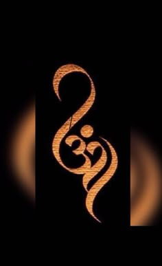 an image of the letter s on a black background with gold swirls in it