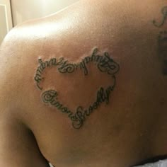 a man with a heart tattoo on his back