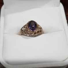 Oval Amethyst Set In A Filigree Setting, Size 5 1/2 , Weighs 1.8 Grams Formal Amethyst Birthstone Ring With Gemstone Accents, Purple 14k Gold Jewelry With Accent Stones, Purple Oval 14k Gold Gemstone, Gold Amethyst Gemstones With Accent Stones, Purple Oval Jewelry For Formal Occasions, Elegant Purple Birthstone Ring For Formal Occasions, Heirloom Oval Purple Jewelry, Elegant Formal Purple Birthstone Ring, Gold Amethyst Jewelry With Accent Stones