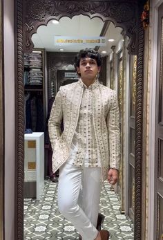 *3 Piece Golden , Open Shrug Set , Groom Special Shurg set . *Fabric: %100 Georgette,Satin  Thick, Warm, Comfortable, Breathable, Softer, Satin Feeling *Center Open  Button Blazer with 6 Button Vest,  With Zipper Fly Pants. *This Suit Has A 6" Drop Which Is The Difference Between The Size Of The Sherwani & Pants. For Example, A 40r Jacket Includes A 34W Pant *Dry Clean Only Important Note: All Our Products Are Made To Order ! Please Contact Us For Perfect Fitting Suit. .Full Lining Tuxedo Suit W Off White Wedding Sets With Dupatta, Off White Cutdana Wedding Sets, Designer Lehenga With Resham Embroidery For Wedding, Fitted White Suit For Festive Occasions, Wedding Sherwani With Intricate Embroidery, Designer Embroidered Sets For Wedding, Designer Embroidered Wedding Sets, Festive White Fitted Suit, Fitted Suits With Intricate Embroidery For Wedding