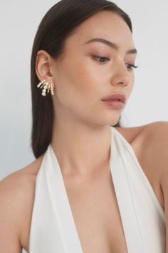 A classic style with a twist, these illusion earrings create the illusion of multiple hoops all in one for a dramatic and glamorous look. Perfect for adding a touch of elegance to your everyday look or making a statement on a special occasion. Pearl White Pearl Earrings For Evening, Glamorous Pearl Earrings For Formal Occasions, Glamorous Formal Pearl Earrings, Glamorous Pearl White Earrings For Formal Occasions, Elegant Hoop Earrings With Ear Wire For Party, Elegant Silver Wrap Earrings, Silver Elegant Wrap Earrings For Party, Elegant Silver Wrap Earrings For Party, Chic Pearl Earrings For Evening