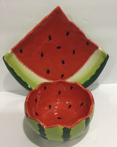 two pieces of watermelon sitting on top of each other