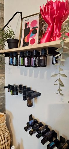 the shelves are filled with bottles of essential oils and other things to put on them