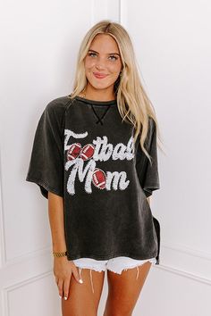 - Sparkle on the sidelines with this adorable 'FOOTBALL MOM' top! Perfect for showing your team spirit, this piece is comfy-casual style with a touch of glam. Its eye-catching design makes it a must-have for every proud football mom. - Unlined sweatshirt material with a vintage wash - A white and red hued 'FOOTBALL MOM' graphic design with rhinestone accents - Unfinished seam accents - A crew cut neckline - Short, loose sleeves - An ultra-relaxed silhouette that ends in a high-low hemline with s Mama Outfits, Football Mom Shirts, Mom Era, Crew Cut, Loose Sleeves, Crew Cuts, Embellished Top, Football Mom, Distressed Shorts