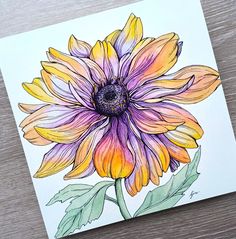 a drawing of a sunflower on a piece of paper with watercolor pencils