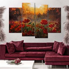 a living room scene with red couches and paintings on the wall above them,