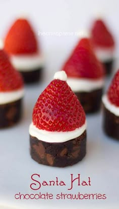 chocolate strawberries with white frosting and santa hat on top