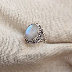 Gemstone - Natural Rainbow Moonstone Gemstone Size - 12x16 mm oval Metal - Sterling Silver natural AAA rainbow moonstone set with a sterling silver handmade ring Each Ring made with Precision and love, these rings are perfect for everyday use and a perfect accessory to wear at work. Rings can be customized on request and gemstone can be switched to any other as per requirement. Other beautiful designs uploaded with fabulous gemstones. kindly visit my store to view the complete collection. Feel f Oval Moonstone Ring For Gift, Oval Moonstone Ring Gift, Silver Oval Cabochon Moonstone Ring For Wedding, Handmade Oval Moonstone Ring For Anniversary, Handmade Moonstone Ring Gift, Dainty Handmade Oval Moonstone Ring, Bohemian Silver Oval Opal Ring, Handmade Moonstone Ring For Gift, Handmade Oval Moonstone Ring Gift