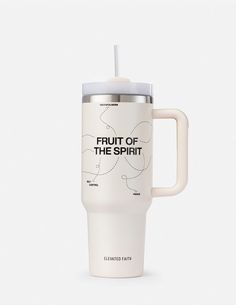 a white travel mug with the words fruit of the spirit printed on it and a straw in its mouth