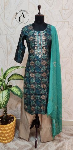 Material: Muslin Silk. Top Length: 47 inches. Pant: 39 inches. Check our size chart for size reference. Green Semi-stitched Cotton Silk Sharara, Green Cotton Silk Sharara With Straight Kurta, Green Printed Motifs Designer Sets, Designer Green Sets With Printed Motifs, Transitional Silk Sets With Floral Print, Festive Pista Green Floral Kurta, Pista Green Floral Print Salwar Kameez With Straight Kurta, Green Silk Sharara With Straight Kurta, Green Sharara With Floral Print