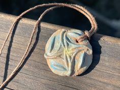 This pendant is hand formed using Sussex Clay before being painted (using a mixture of underglazes) and fired. Varying colours are applied to the front and sides, leaving the rear partially unglazed so the natural quality of the clay can be appreciated.  I have hung the pendant on hemp (left loose for you to tie at your preferred length).  Comfortable to wear and completely unique. Your necklace will arrive in a smart recycled gift box tied with natural nettle string.  Beautiful artisan jewellery to own or send as a gift. Lynda 🌱 Peach Necklace, Recycled Gifts, Ceramic Necklace, Sea Glass Necklace, Glass Necklace, Unique Necklaces, Artisan Jewelry, Handmade Necklaces, Necklace Etsy