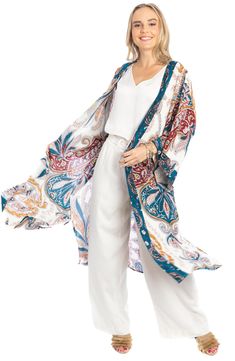 Love to layer all of your look in this bohemian-inspired duster that is covered in a bright medallion pattern. Open front Short sleeves 100% rayon Hand wash, line dry Imported Model stats: 5'10", 32" bust, 25" waist, 36" hip. Model is wearing size One Size. Bohemian Long Printed Outerwear, Bohemian Printed Summer Outerwear, Summer Bohemian Patterned Outerwear, Bohemian Blue Outerwear For Vacation, Multicolor Bohemian Outerwear With Paisley Print, Bohemian Multicolor Paisley Print Outerwear, Bohemian Spring Outerwear With Paisley Print, Bohemian Outerwear With Paisley Print For Spring, Bohemian Patterned Beach Outerwear