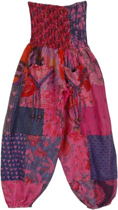 A mixed-print patchwork pants in a vibrant pink tone for the young ones.  These soft cotton hippie pull-on pants have a smocking elastic waist, two functional front pockets, and elastic bottom. #tlb #SplitSkirtsPants #Patchwork #bohemianfashion #Handmade #GirlsHippiePants #CountryPants #KidsPants Summer Pink Patchwork Pants, Pink Cotton Patchwork Bottoms, Pink Cotton Patchwork Pants, Casual Pink Patchwork Bottoms, Pink Cotton Harem Pants With Pockets, Pink Cotton Harem Pants For Spring, Hippie Floral Patchwork Bottoms For Festival, Pink Cotton Spring Harem Pants, Spring Pink Cotton Harem Pants