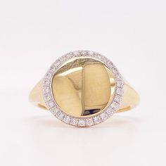 a yellow gold and diamond signet ring