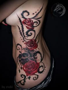 a woman's stomach with roses on it