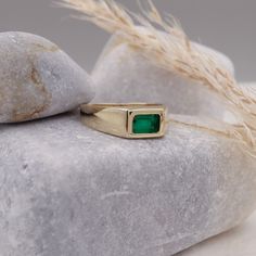 This 14k Natural Emerald Baguette Signet Ring is an exquisite piece of May birthstone jewelry. Crafted with precision, this ring showcases a vibrant green natural emerald stone, symbolizing youth and rejuvenation. Designed to suit both men and women, it serves as a versatile accessory, perfect for any occasion. The chunky yet elegant design adds a touch of sophistication, while the pinky ring style adds a trendy element. Whether it's an anniversary celebration or a special gift, this ring makes a truly timeless and meaningful statement. Elevate your jewelry collection with this mesmerizing emerald signet ring. Measurements: * Gem Stones: 100% Natural Emerald * Center Stone Measurements: 6.00x4.00 Approx. 0.50 * Color and Clarity: Clear Green * Material: High-Quality Solid Gold 14/18k ----- Emerald Stone Rings For Men, Men's Sapphire Ring, Emerald Signet Ring Men, Fine Jewelry Green Signet Ring With 17 Jewels, Modern Jewelry With Rectangular May Birthstone, Luxury 14k Gold Emerald Ring Rectangular Shape, Luxury 14k Gold Rectangular Emerald Ring, Luxury 14k Gold Emerald Ring With Rectangular Shape, Modern Emerald Cut May Birthstone Jewelry