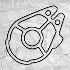 a black and white photo of a steering wheel on a piece of wood with the word,