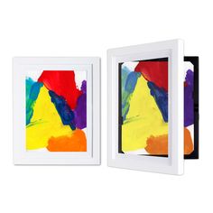 two white frames with colorful paintings on them