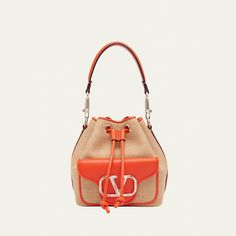 Valentino Garavani "Loco" bucket bag in polyester, metal, and raffia  Detachable flat top handle  Detachable, adjustable web shoulder strap Can be worn as a top handle or shoulder bag  Drawstring closure  Exterior, VLOGO front flap pouch  Lining: Cotton Approx. 7.5"H x 6.3"W x 4.3"D Made in Italy Drawstring Bucket Bag, Flats Top, Goldfish, Bergdorf Goodman, Valentino Garavani, Drawstring Bag, Bucket Bag, Top Designers, Top Handle