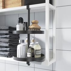 a bathroom shelf filled with lots of toiletries