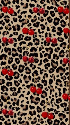 an animal print pattern with cherries on it