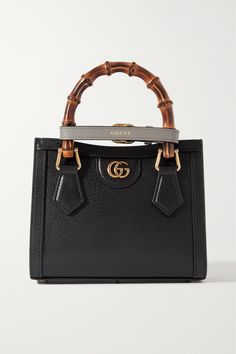 Gucci's 'Diana' tote was first introduced in 1991 and has since become an iconic style. Made from textured-leather, it's distinguished by its square shape, bamboo top handles - a house signature since 1947 - and 'Double G' gold-tone hardware. It comes with two detachable straps that can be worn on your shoulder or cross-body. Gucci Brown Calf Leather Bag, Brown Gucci Calf Leather Bag, Gucci Calf Leather Shopping Bag, Chic Gucci Textured Leather Shoulder Bag, Gucci Calf Leather Tote Bag, Gucci Textured Leather Bag For Formal Occasions, Gucci Textured Leather Formal Bag, Formal Gucci Textured Leather Bag, Designer Gucci Textured Leather Shoulder Bag