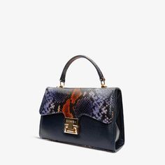 Width: 9" Height: 7" Width: 4.5" Full length of the strap : 41" Venezia Navy Blue Leather Handbag: Timeless Sophistication in Deep Blue Hues Supreme Quality Craftsmanship: Immerse yourself in luxury with this handbag, meticulously crafted from 100% genuine calf leather, ensuring an unparalleled standard of excellence. Elegant Embossed Pattern: The leather cover features a subtle yet sophisticated embossed pattern, adding a touch of timeless allure and elevating the Venezia Navy Blue Handbag to a Navy Blue Handbags, Blue Handbag, Embossed Pattern, Python Print, Leather Pouch, Blue Hues, Leather Cover, Leather Handbag, Blue Leather