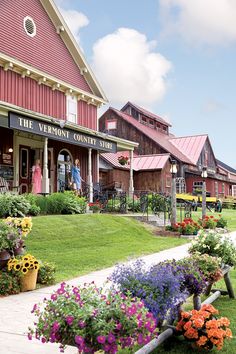 the vermont country store is surrounded by colorful flowers