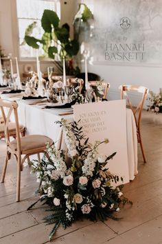 a table set up with flowers and candles for a formal dinner or reception at hannah baskett