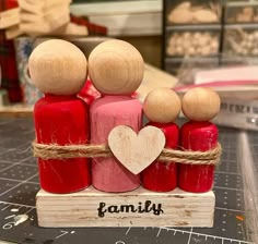 a family figurine sitting on top of a cutting board