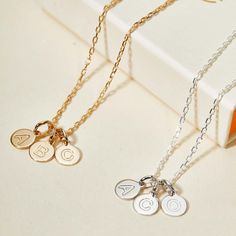 An imprint on your heart and on your jewelry, our Personalized Letter Pendant Necklace is the perfect way to treasure the love of your little ones. Choose up to 5 letter pendants to represent your children's initials, hand-engraved with their names or date of birth on the reverse.18K Champagne Gold Plated or 925 Sterling SilverLetter charm: 0.3Secure clasp fasteningCharms are removable from this chain and can be worn on all Merci Maman chain lengthsHand-engraved in our Paris WorkshopSent with lo Classic Personalized White Gold Charm Necklace, White Gold Charm Necklaces With Initials For Everyday, Everyday White Gold Charm Necklaces With Initials, White Gold Initial Pendant Charm Necklace For Mother's Day, Personalized Nameplate Charm Necklace In Dainty Style, Personalized White Gold Charm Necklaces For Personalized Gift, White Gold Initial Necklace For Mother's Day, Personalized White Gold Round Charm Necklaces, Personalized Sterling Silver Charms For Gifts