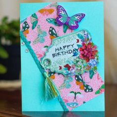 a happy birthday card with butterflies on it