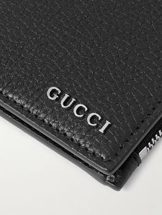 Gucci's billfold wallet has space for your cards, notes, and coins. It's crafted from full-grain leather that'll stand up nicely to daily use and is embellished with the brand's sleek silver-tone logo. Designer Trifold Wallet With Card Slots, Designer Business Trifold Wallet, Designer Leather Wallet With Smooth Grain, Gucci Bifold Wallet With Coin Pocket, Designer Leather Wallet With Rfid Blocking, Designer Trifold Wallet With Coin Pocket For Business, Designer Bifold Wallet With Leather Lining, Designer Bifold Business Wallet, Gucci Rectangular Wallet With Rfid Blocking