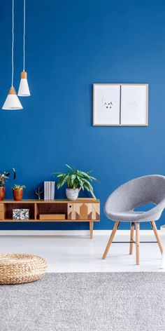 a living room with blue walls and furniture