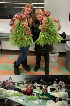 two women standing next to each other in front of tables with vegetables on them and people sitting at desks behind them