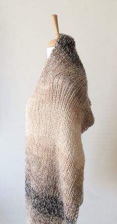 "This hand knit scarf is perfect and cozy accessory to keep you warm and stylilsh. This knit scarf is super large and wide made with softest and airy soft angora wool The scarf is long to make two loops, its very soft and comfortable. Material: extra soft and very light angora wool Color: Beige with shades of bronze Width: 60 cm / 24\" Care: Handwash in luke warm water, lay flat to dry. Can also be washed in a washing mashing at gentle cycle, do not tumble dry 100% Handknit with love and care to Wool Knit Scarf, Teal Scarf, Knitted Cowl Scarves, Cozy Accessories, Hand Knit Scarf, Oversized Scarf, Knit Cowl, Cowl Scarf, Knit Scarf